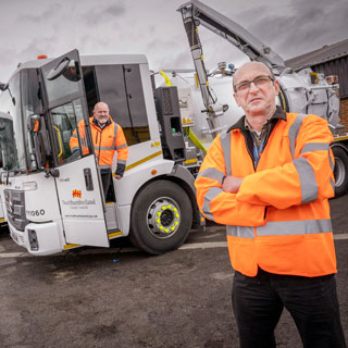 Staff standing in front of the council's new gully sucker fleet