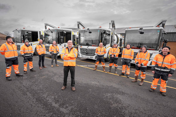 Staff standing in front of the council's new gully sucker fleet