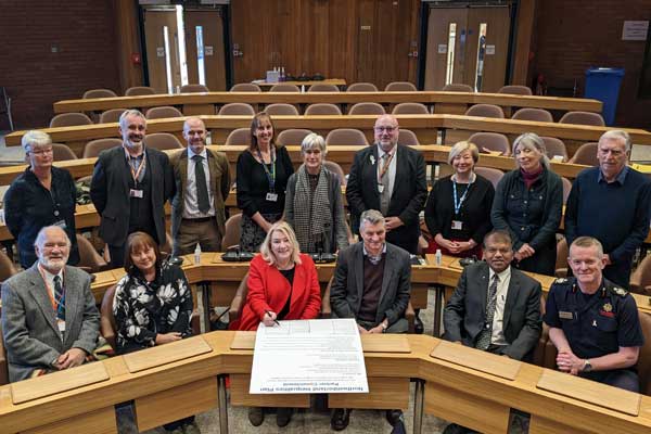 People signing the county council's inequality plan