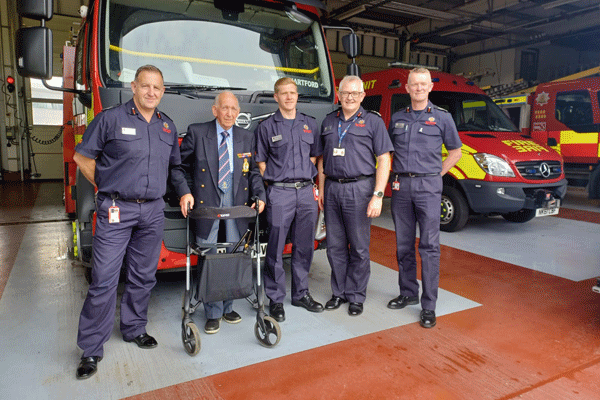 100 yr old firefighter with fire personnel