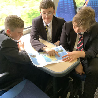 Scholchildren on a train between Newcastle and Morpeth