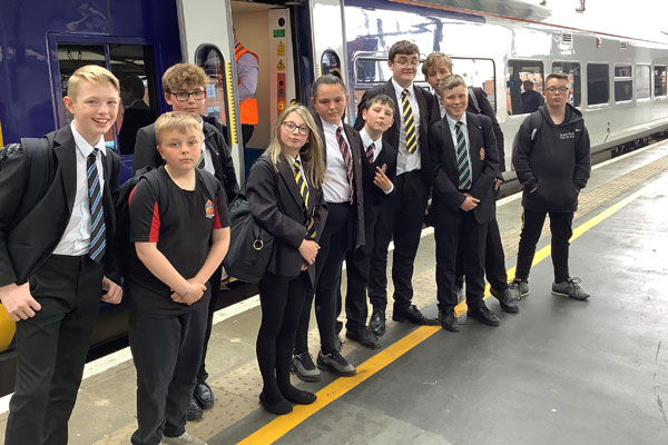 Schoolchildren get read to board a train between Morpeth and Newcastle