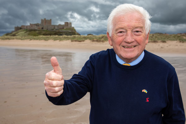 Councillor Jeff Watson celebrates Bamburgh being named the UKs best seaside destination