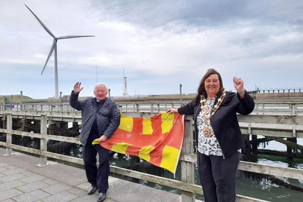 Councillors Jeff Watson and Margaret Richardson celebrate the Queen's Baton Relay coming to the county