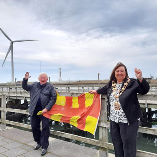 Councillors Jeff Watson and Margaret Richardson celebrate the Queen's Baton Relay coming to the county