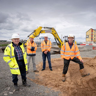 Councillors at a new car park in Amble which is set to open this summer