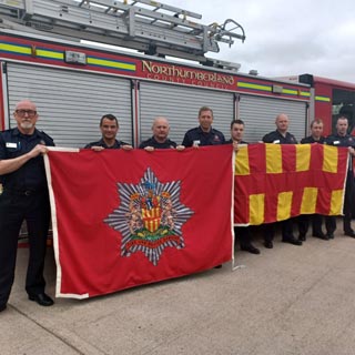 Northumberland Firefighters in Ukraine with a fire engine.