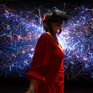 A woman wearing a virtual reality headset. The region has secured  Government funding for the creative industries