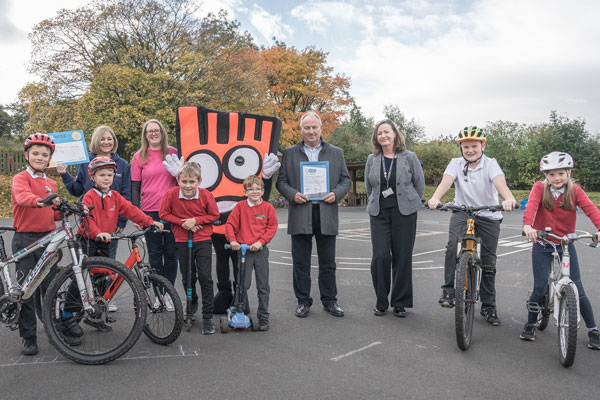 Pupils at Allendale Primary School celebrating being shortlisted for a national award for their commitment to choosing cleaner and healthier ways to travel to school.