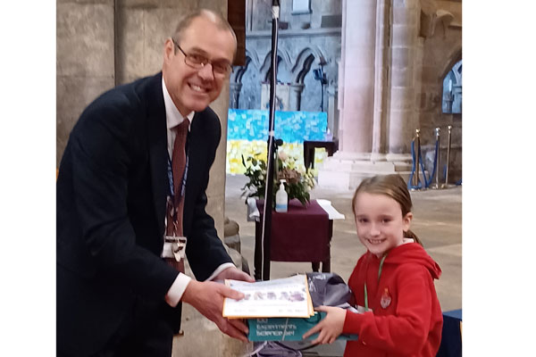 Graeme Atkins, Executive Head of Queen Elizabeth High School, Hexham, presented Lauren Downall, with her for prize for taking part in the Summer Reading Challenge. 2,500 youngsters took part – reading