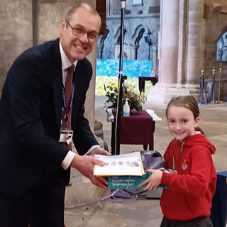 Graeme Atkins, Executive Head of Queen Elizabeth High School, Hexham, presented Lauren Downall, with her for prize for taking part in the Summer Reading Challenge. 2,500 youngsters took part – reading