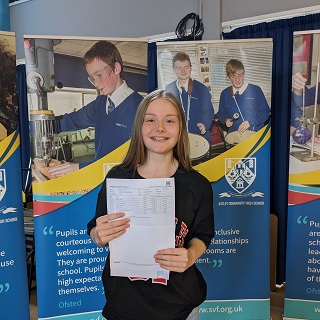 Student receiving results at Astley Community High School