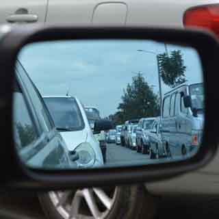 A traffic jam viewed from a rear view mirror