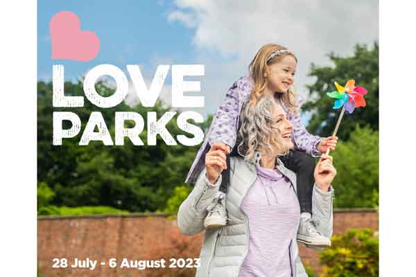 A child on a woman's shoulders celebrating Love Parks Week