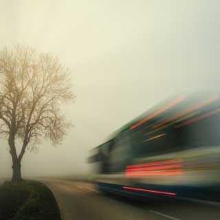 A bus driving in a country road. The council as welcomed more Government funding for services