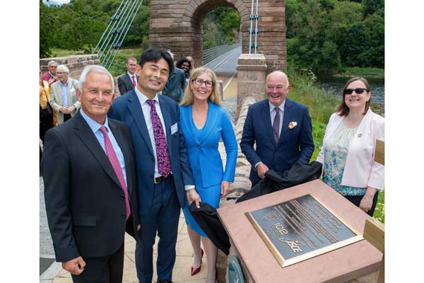 A plaque is unveiled honouring the restoration of the Union Chain Bridge