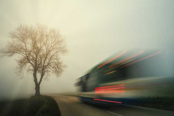 A bus driving in a country road. The council as welcomed more Government funding for services