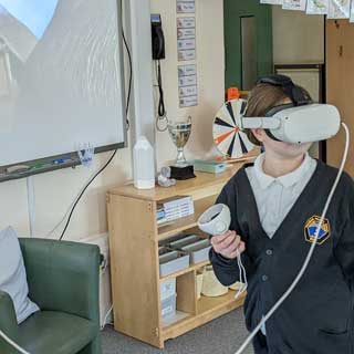 A Newsham Primary School pupil trying a virtual reality headset