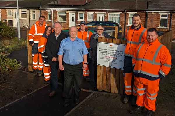 Councillors and staff outside new bin compounds in the Hirst area of Ashington