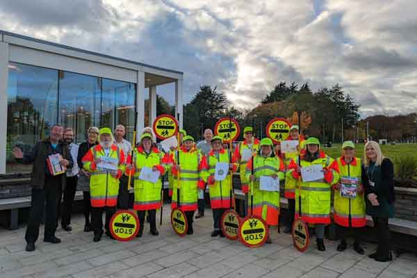 School crossing patrol staff outside County Hall celebrating the service's 70th anniversary
