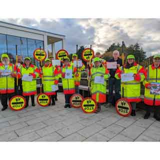 School crossing patrol staff outside County Hall celebrating the service's 70th anniversary