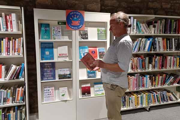 A man browsing books during Green Libraries Week