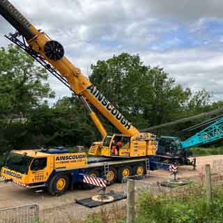 A crane carrying out landslip work at Todstead near Rothbury