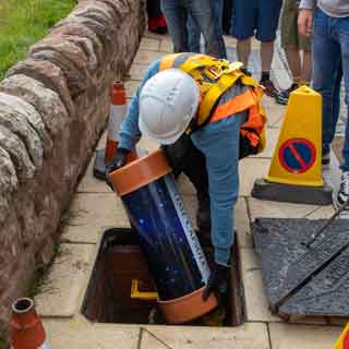 A time capsule being buried at the Union Chain Bridge