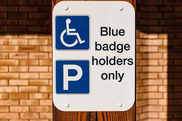 A blue badge holder only sign