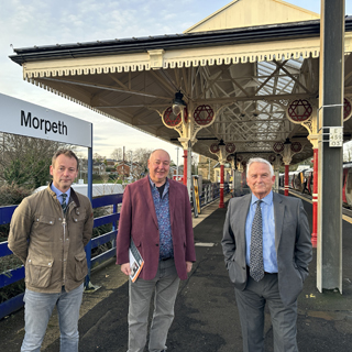 Councillor Richard Wearmouth, Dennis Fancett and Council Leader Glen Sanderson at Morpeth Rail Station