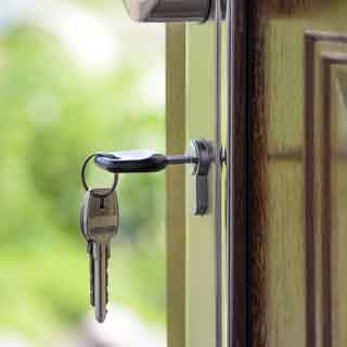 A photo of a key in a door.