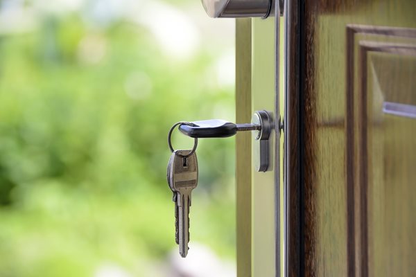 A photo of a key in a door.