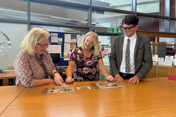 People looking through Northumberland Archives