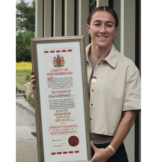 Lucy Bronze with the Freedom of Northumberland scroll