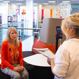 A council officer talking to a camera while being filmed