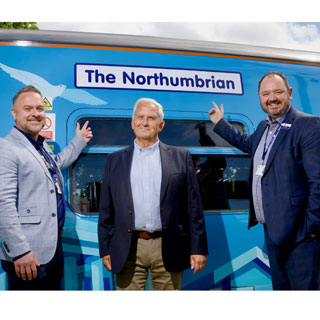 Council leader Glen Sanderson and Northern staff with a newly wrapped train