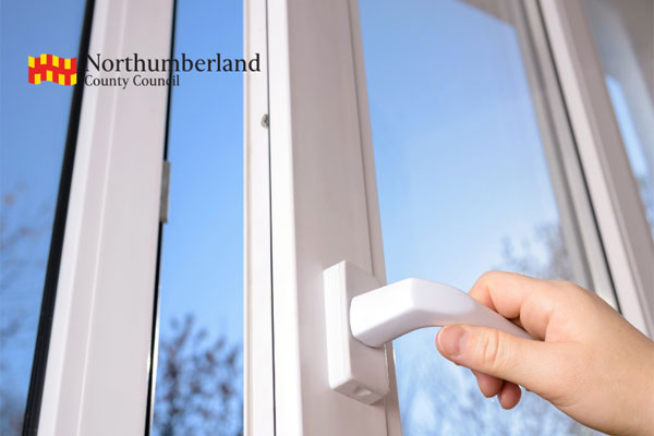 A person opening a UPVC window