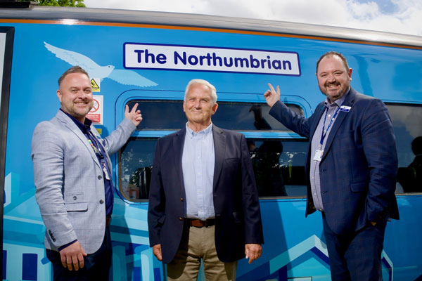Council leader Glen Sanderson and Northern staff with a newly wrapped train