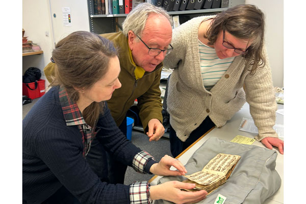 Caption: The image entitled Looking at Henry Atkinson's book shows Matthew Bannister Radio 3 Radio 3 presenter, Prof Kirsten Gibson and Dr. Steph Carter.