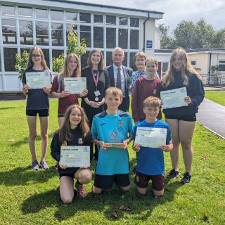 Adele Brown, Headteacher, Glen Sanderson, Council Leader, Dr Meryl Batchelder, Science Subject Leader with Go Green Gorillas from Corbridge Middle School