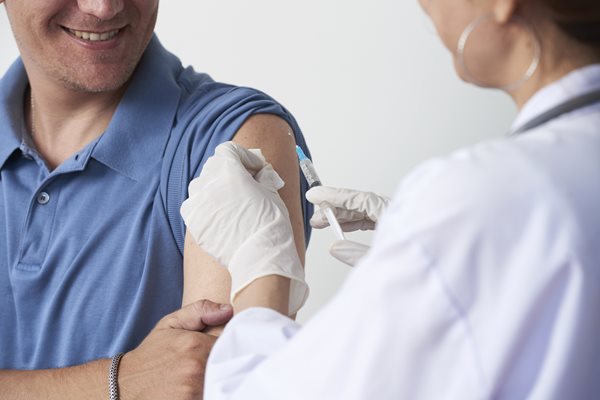 Man being given a vaccination