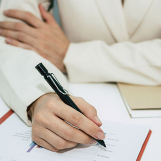 Woman writing a plan document