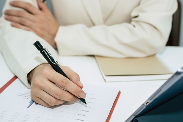 Woman writing a plan document