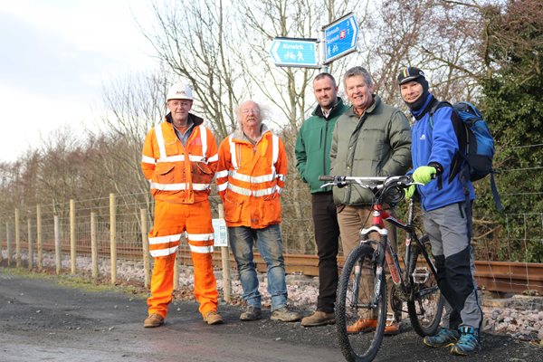 Councillors and railway staff on a new cycle track