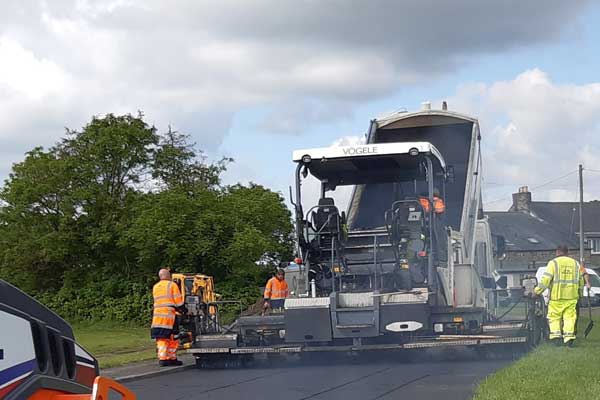 Workers repairing a road