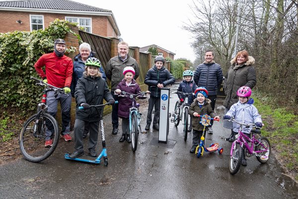 Children and adults with a new cycle signpost