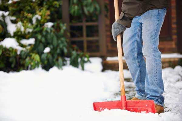 Man clearing snow from a path