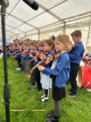 A performance from young schoolchildren with violins