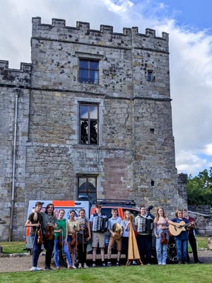 Another shot of the band with their instruments in front of the castle
