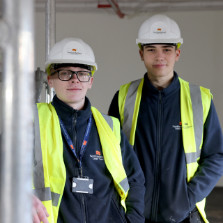 Highways apprentice holding cone